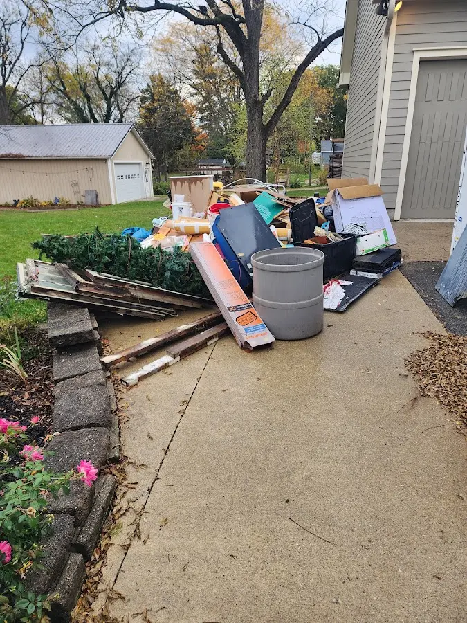Dumpster being loaded with debris for Commercial Dumpster Rental in Fort Knox
